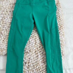 Athleta bright green Performance Leggings, side zip pockets and pin hole detail